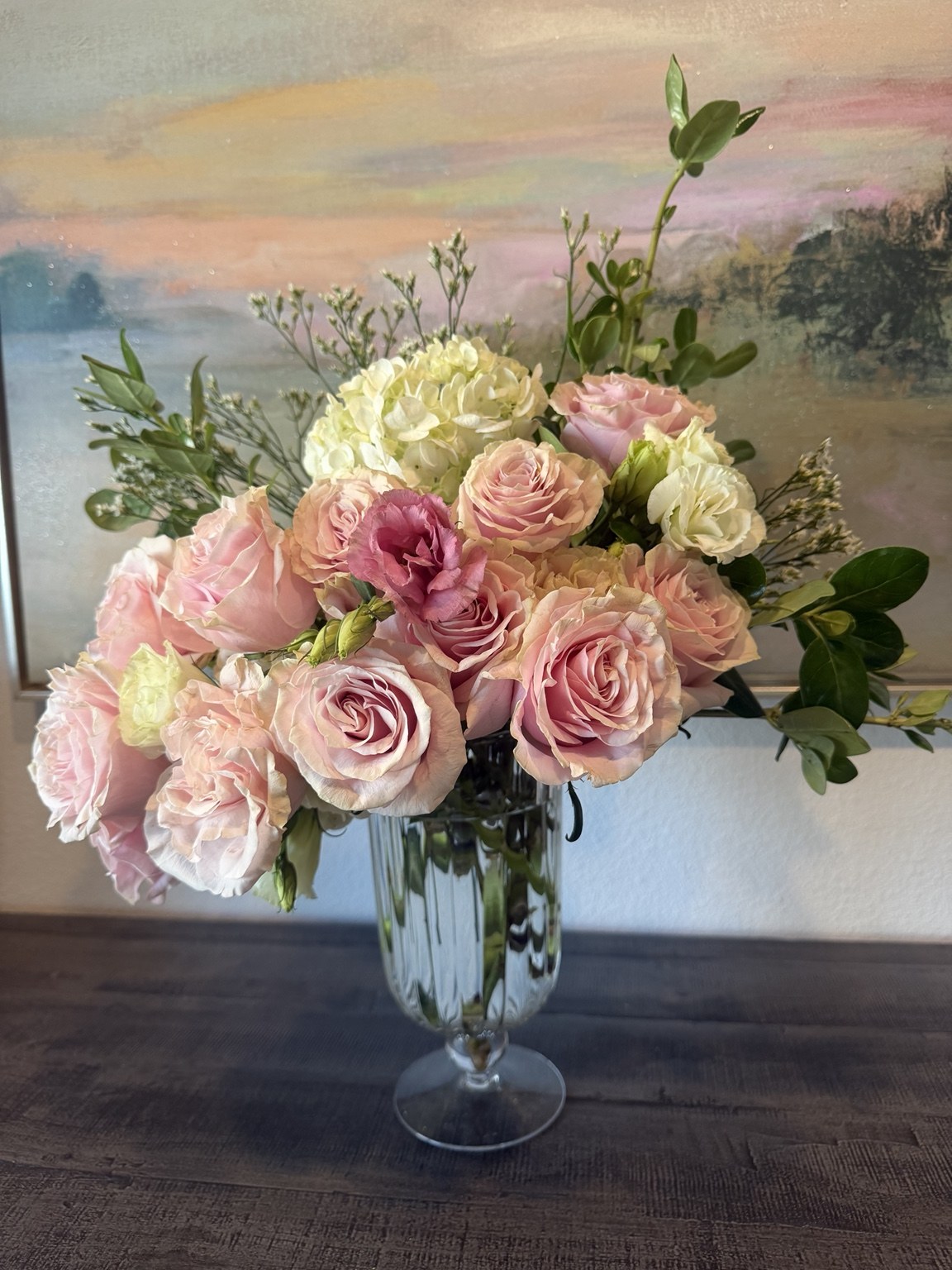 Pastel pink rose and hydrangea arrangement in a glass vase by Petite Petal