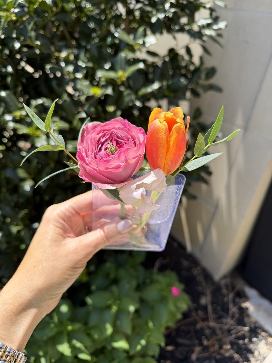 Small romantic floral detail featuring pink roses and orange tulips by Petite Petal